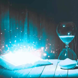 livre scintillant avec sablier dans les tons bleus clairs - formations énergétiques et bien être